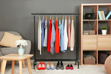 Wall Mural - Rack with collection of clothes in dressing room