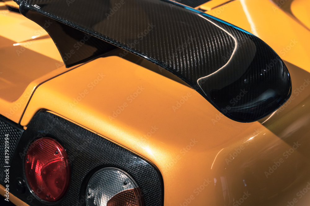 Spoiler Automotriz Car aerodynamics carbon spoiler and rear lights Stock Photo | Adobe Stock