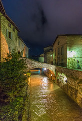 Wall Mural - Gubbio (Italy) - One of the most beautiful medieval towns in Europe, in the heart of the Umbria Region, central Italy. Here in particular the historic center in the night.