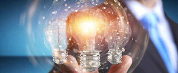 Poster - Businessman connecting modern lightbulbs with connections 3D rendering