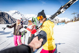 Group of friends going to ski on the alps