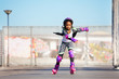 © Sergey Novikov - African girl rollerblading fast at skate park