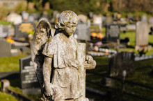 Stone Angel On A Gravestone In A Cemetery