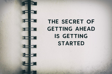 Wall Mural - Inspirational Quote - The secret of getting ahead is getting started. Blurry retro background.