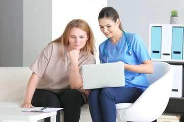 Poster - Young female doctor consulting overweight woman in clinic