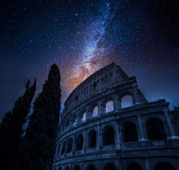 Wall Mural - Beautiful Colosseum in Rome at night and milky way, Italy