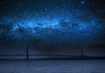 Wall Mural - milky way over bay in queensferry, scotland