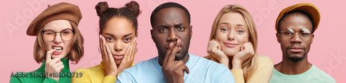 Fotomural Thoughtful concentrated dark skinned plump male, pretty blonde woman listens int