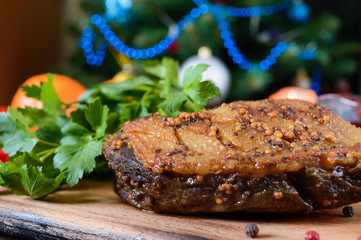 Wall Mural - Duck breast - Magret with berry sauce on the background of Christmas decorations. Christmas menu. French cuisine. Festive dish.