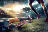 Fototapeta Fototapety sport - The soccer football players at the stadium in motion
