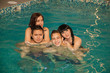 © izida1991 - Friends at a party by the pool. Girls in a bikini. Guys in swimming trunks