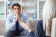 © Elnur - Young man visiting psychiatrist doctor for consultation