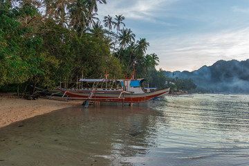 Bangka boat view at beautiful sunset on El Nido bay, Palawan island, Philippines