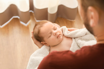 Wall Mural - Father with cute little baby at home