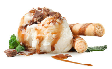 Wall Mural - Ice cream ball with caramel sauce and wafer sticks on white background