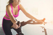 © Prostock-studio - Woman in gym on exercise bikes