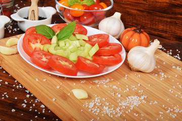 sliced tomatoes with celery, garlic pepper for a healthy snack with free space for text