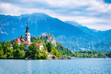 Bled lake with church island and mountains in the background.