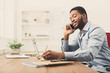 © Prostock-studio - Young black businessman talking on mobile phone