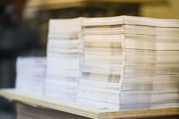 High Contrast, Stack of Printed Paper. Industry Offset Sheets in printing factory.