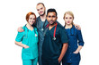 © andrey_orlov - team of young mixed race doctors isolated working in a hospital. whitebackground