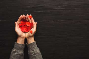 Wall Mural - Valentine day background, clothespins in female hands