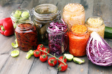 Jars With Variety Of Pickled Vegetables. Preserved Food