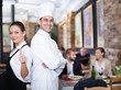 © JackF - Smiling waitress with chef in the restaurant
