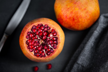 Poster - Sliced pomegranate with juicy red grains