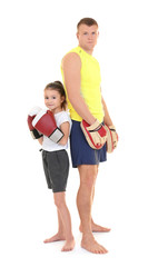 Poster - Cute little girl with boxing coach on white background