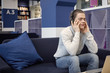 © Anatoliy Karlyuk - People, relaxation, leisure and entertainment concept. Casually dressed young man practicing meditation, listening to music using headphones, closing eyes, having calm and peaceful expression