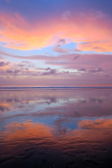 Wall Mural - Empty Kuta beach with amazing colors sunset and sky reflection, Bali, Indonesia