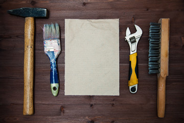 working tools laid out on a wooden background. Concept of construction, wooden background, space for text. Top view