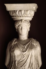 Decorative Caryatid statue inside a building in Athens, Greece.