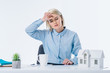 © LIGHTFIELD STUDIOS - portrait of tired real estate agent at workplace
