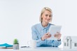 © LIGHTFIELD STUDIOS - portrait of smiling real estate agent with tablet at workplace