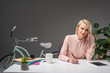 © LIGHTFIELD STUDIOS - portrait of businesswoman talking on smartphone while making notes at workplace