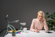© LIGHTFIELD STUDIOS - portrait of businesswoman talking on smartphone while making notes at workplace