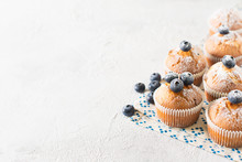 Blueberries Muffins Or Cupcakes On White Texture