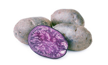 Fresh Purple Potatoes Isolated On A White Background