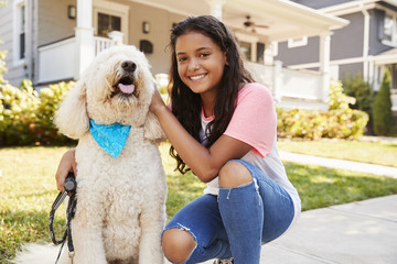 Wall Mural - Portrait Of Girl With Dog On Suburban Street