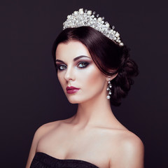 Canvas Print - Fashion Portrait of Beautiful Woman with Tiara on head. Elegant Hairstyle. Perfect Make-Up and Jewelry. Red Lips