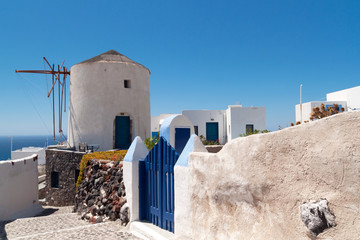 Wall Mural - Windmill of Oia village on Santorini island, Greece