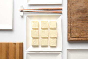 Wall Mural - Tofu diced and served in a square plate, concept table setting