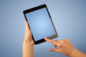 Poster - Female hand holding tablet