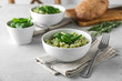 Dish with delicious spinach risotto on table