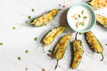 Homemade Jalapeno poppers with white dipping sauce