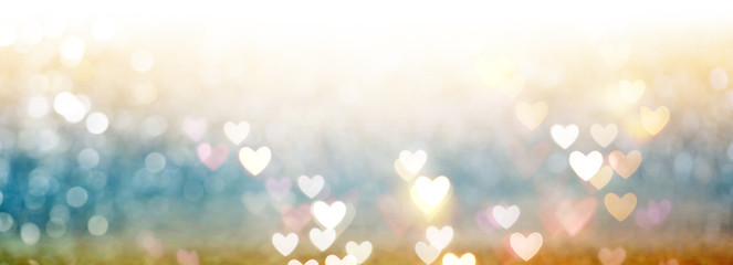 Beautiful shiny hearts and abstract lights background