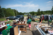 Mother And Daughter Shop At Garage Sale