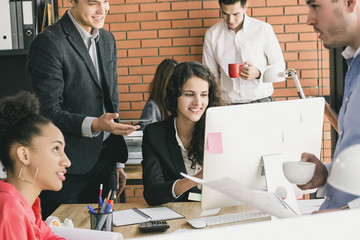 Wall Mural - Multiethnic business team working in the office